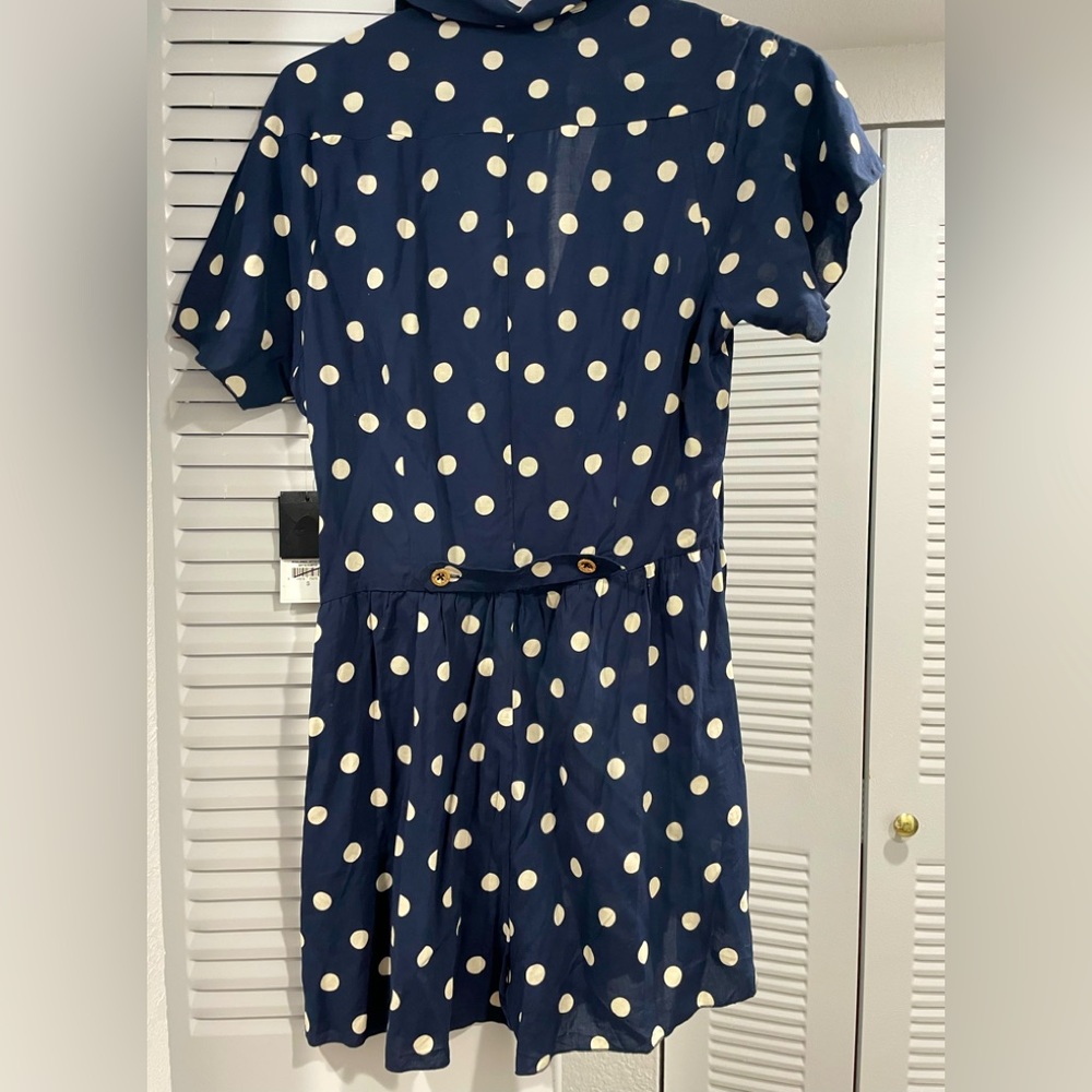 Juicy Couture navy short romper with white polka dots.